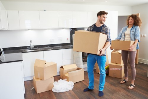 Professional office movers handling workplace equipment